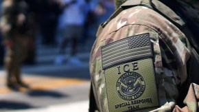 An ICE Special Response Team member stands guard outside the Metropolitan Detention Center, while protesters gathered outside to denounce ICE operations, Tuesday, June 10, 2025, in downtown Los Angeles. (AP Photo/Eric Thayer)